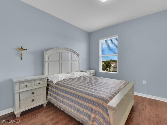 2739 Merida Ln, Cape Coral, FL 33909 - bedroom featuring baseboards and dark wood-style flooring