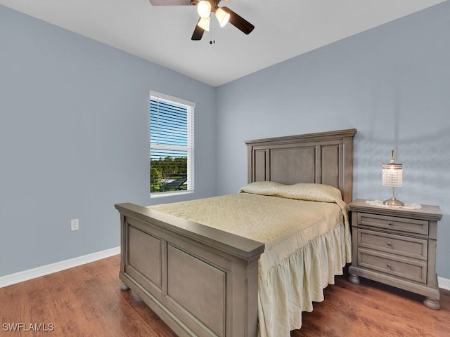 2739 Merida Ln, Cape Coral, FL 33909 - bedroom featuring a ceiling fan, baseboards, and dark wood-style flooring