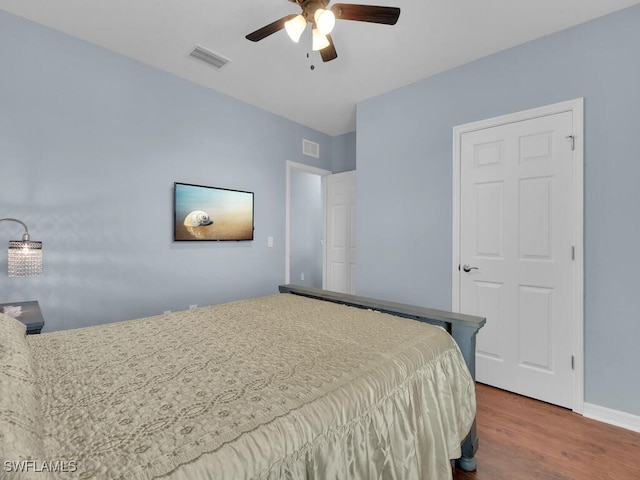 2739 Merida Ln, Cape Coral, FL 33909 - bedroom with baseboards, wood finished floors, visible vents, and a ceiling fan