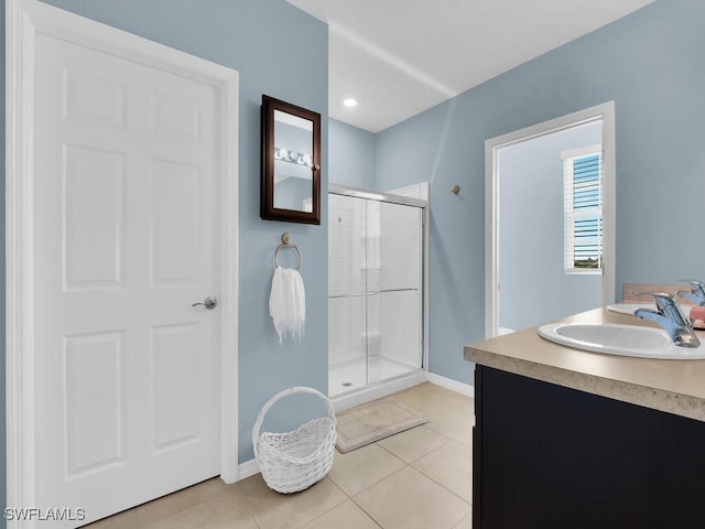2739 Merida Ln, Cape Coral, FL 33909 - full bathroom featuring a shower stall, baseboards, vanity, and tile patterned floors
