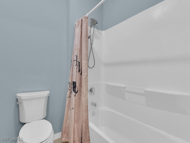 2739 Merida Ln, Cape Coral, FL 33909 - bathroom featuring baseboards, shower / tub combo with curtain, and toilet