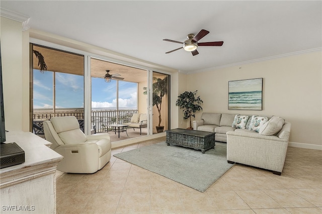 living room with floor to ceiling windows, crown molding, ceiling fan, and light tile patterned floors