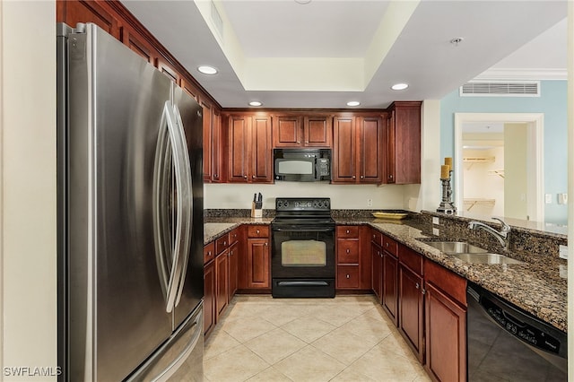 2090 W First St Unit 1609, Fort Myers, FL 33901 - kitchen with visible vents, a sink, light tile patterned floors, black appliances, and dark stone countertops