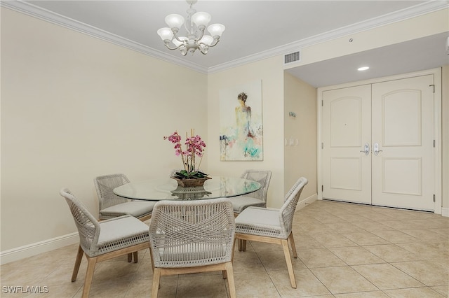 tiled dining room with a notable chandelier and ornamental molding