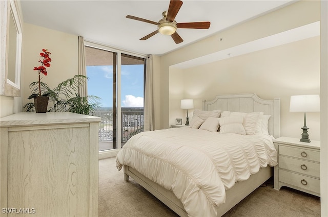 carpeted bedroom with ceiling fan and access to outside