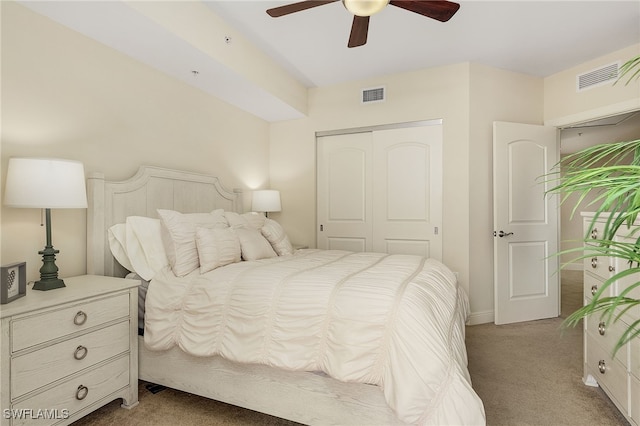 carpeted bedroom with a closet and ceiling fan