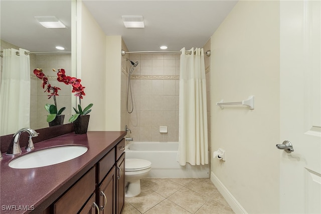 full bathroom featuring toilet, shower / bath combination with curtain, vanity, and tile patterned flooring