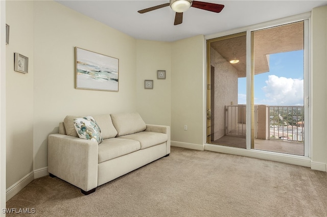 living room featuring light carpet and ceiling fan