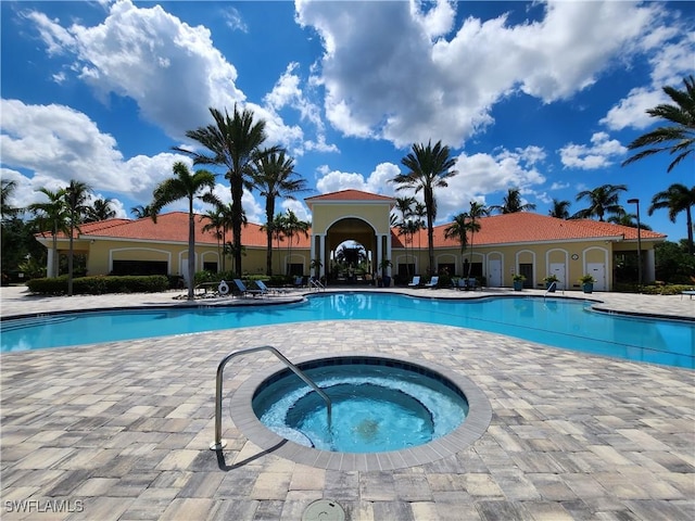 view of pool featuring a community hot tub