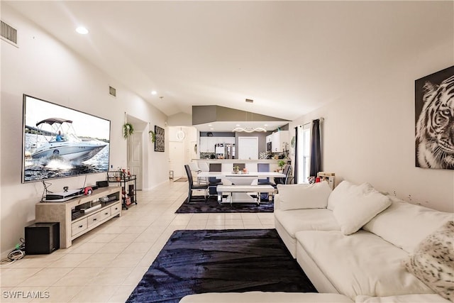 tiled living room featuring a wealth of natural light and lofted ceiling