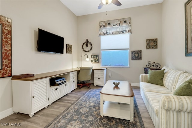 living room with ceiling fan and hardwood / wood-style flooring