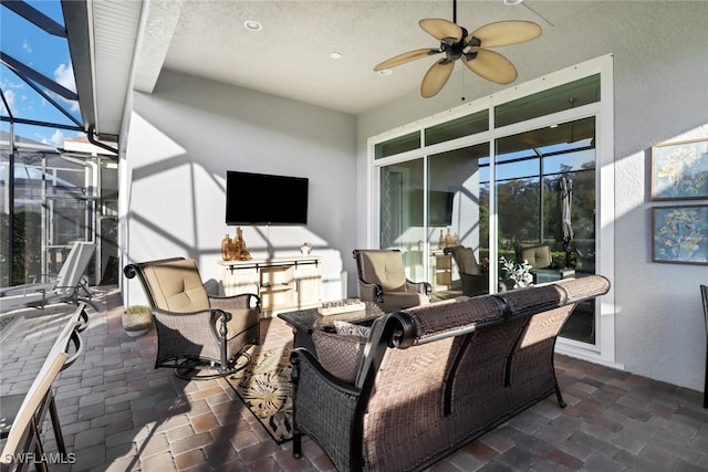 view of patio with a lanai and ceiling fan