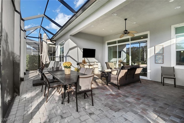 view of patio with a lanai and ceiling fan