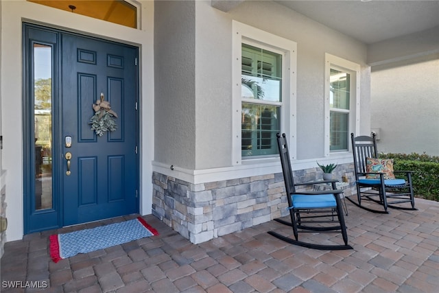 property entrance featuring covered porch