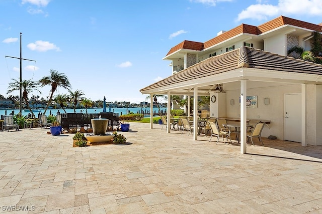 view of patio with a water view