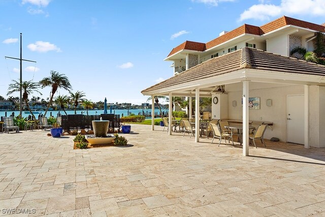 222 Harbour Dr Unit 314, Naples, FL 34103 - view of patio / terrace featuring a water view and outdoor dining space