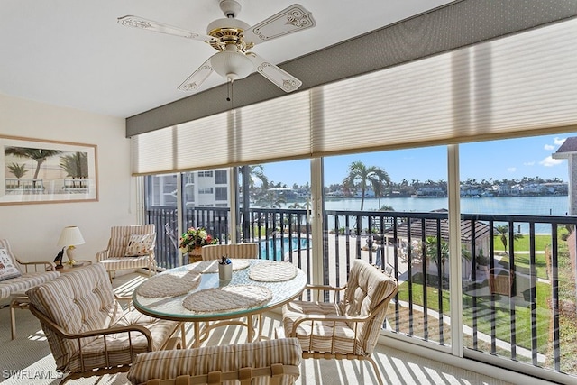 222 Harbour Dr Unit 314, Naples, FL 34103 - sunroom featuring plenty of natural light and a water view