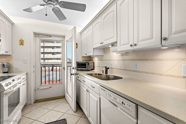 222 Harbour Dr Unit 314, Naples, FL 34103 - kitchen with light tile patterned flooring, ceiling fan, a sink, white appliances, and backsplash