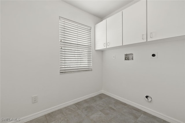 laundry room with cabinets, hookup for an electric dryer, and hookup for a washing machine