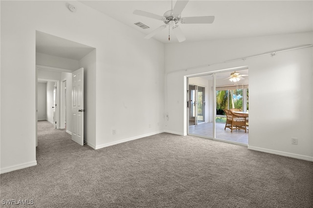 empty room with carpet, vaulted ceiling, and ceiling fan