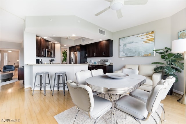 dining space featuring light hardwood / wood-style flooring and ceiling fan