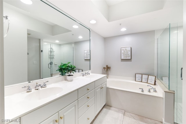 bathroom with vanity, shower with separate bathtub, and tile patterned floors