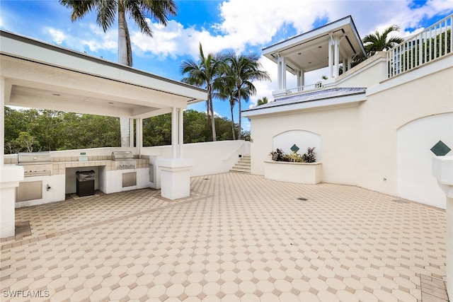 view of patio / terrace with area for grilling and a grill