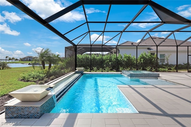 view of swimming pool with a water view, glass enclosure, a pool with connected hot tub, and a patio area