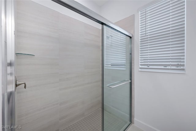 bathroom featuring a shower stall