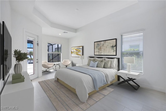 bedroom featuring access to exterior, baseboards, and light tile patterned flooring