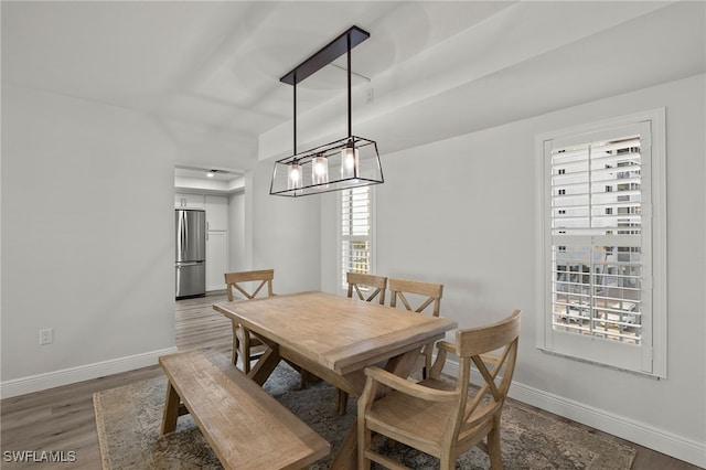 dining room with dark hardwood / wood-style flooring