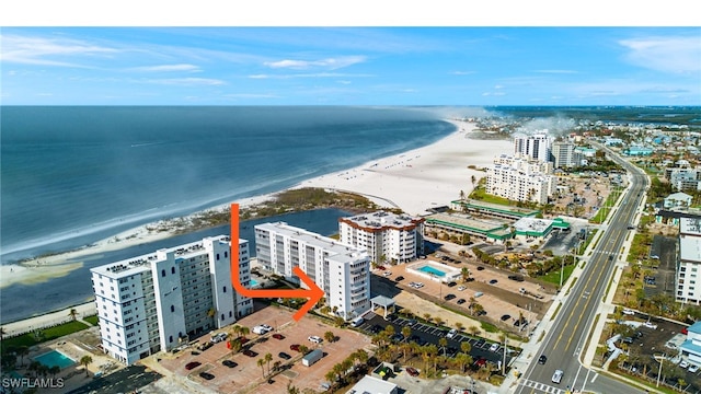 aerial view with a water view, a view of the beach, and a city view