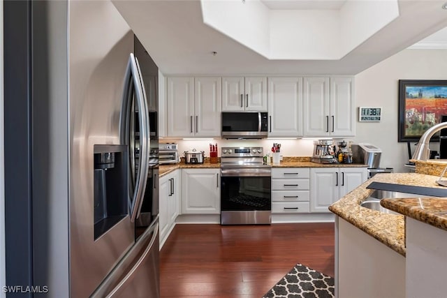 kitchen with white cabinetry and stainless steel appliances