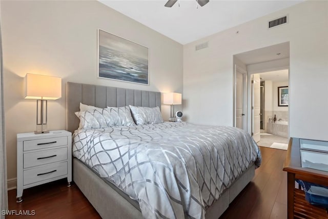 bedroom with dark hardwood / wood-style floors, ensuite bath, and ceiling fan