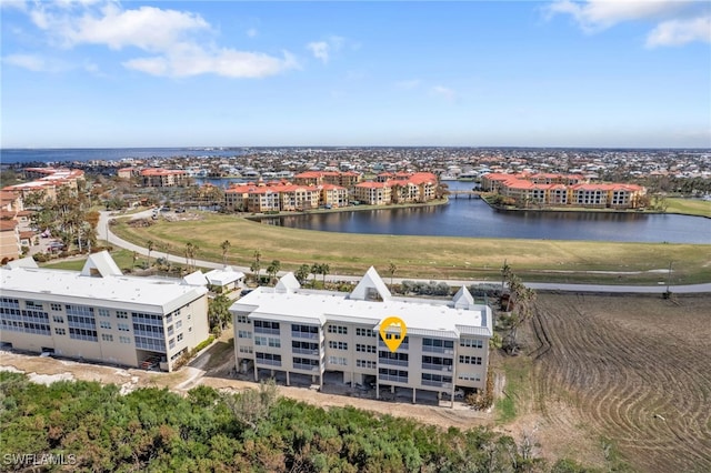 birds eye view of property with a water view