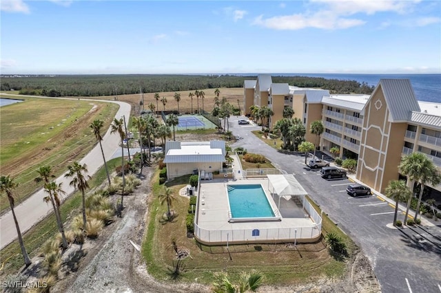 birds eye view of property with a water view