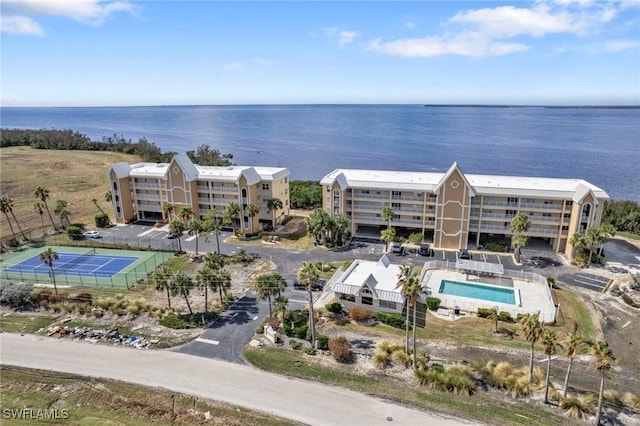 birds eye view of property with a water view