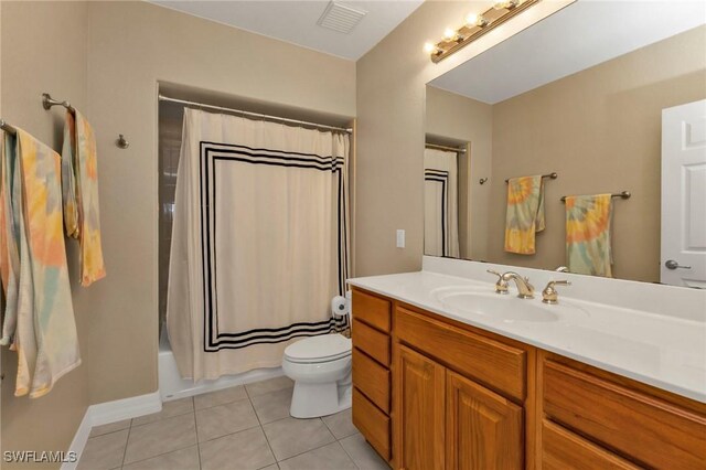 101 N Marion Ct Unit 122, Punta Gorda, FL 33950 - full bathroom with vanity, tile patterned floors, toilet, shower / bath combination with curtain, and baseboards