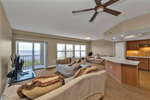 living room with recessed lighting, visible vents, ceiling fan, light wood-type flooring, and baseboards