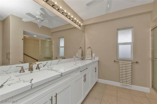 full bath with a ceiling fan, tile patterned flooring, a sink, and a shower stall