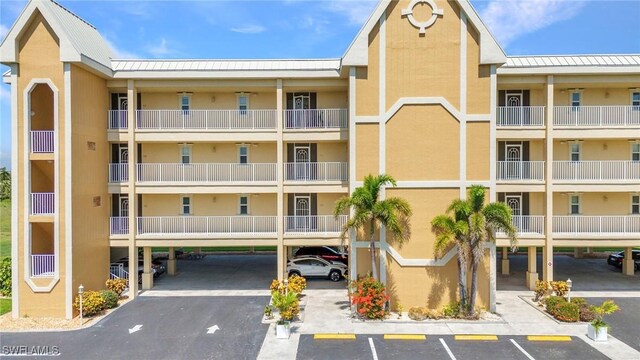101 N Marion Ct Unit 122, Punta Gorda, FL 33950 - view of apartment building / complex with covered and uncovered parking