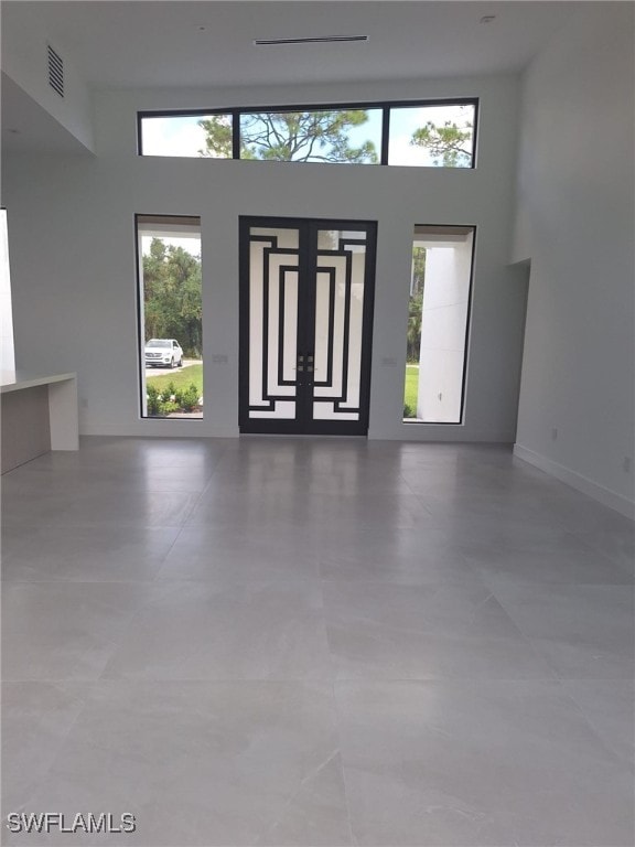 foyer entrance with a high ceiling and plenty of natural light