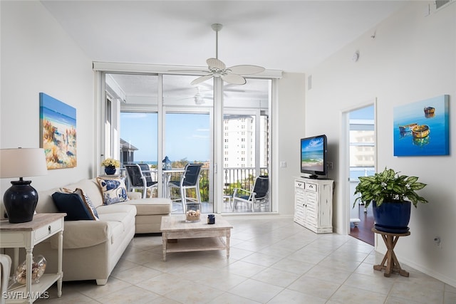 tiled living room featuring ceiling fan