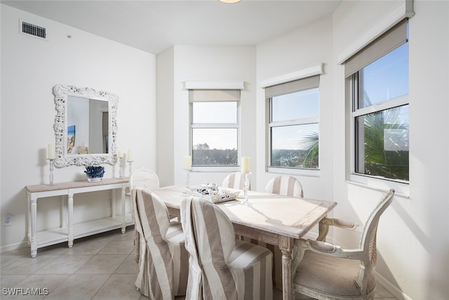 dining room featuring a wealth of natural light and light tile patterned floors