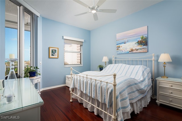 bedroom with ceiling fan and dark hardwood / wood-style flooring