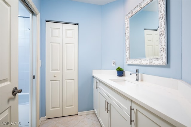 bathroom with tile patterned flooring and vanity