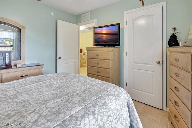 bedroom featuring light tile patterned floors