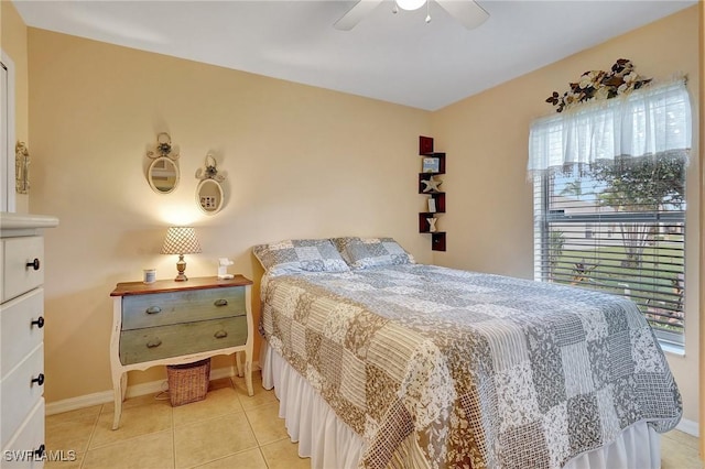 bedroom with ceiling fan and light tile patterned floors