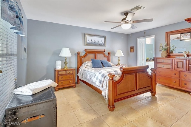 bedroom with ceiling fan and light tile patterned floors