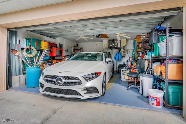 garage with ceiling fan and a garage door opener